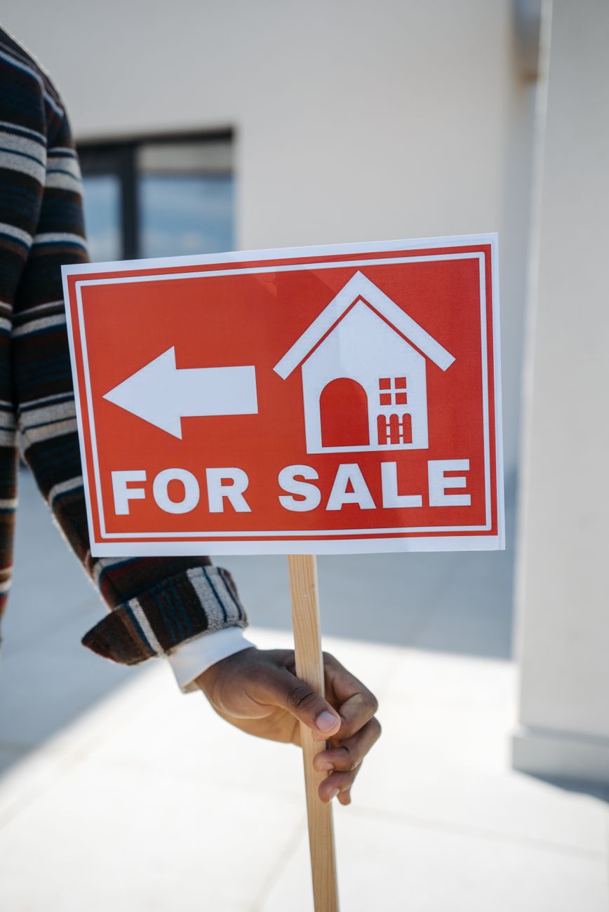 For Sale sign outside a house